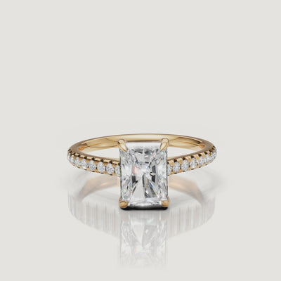Rotating video of Raul Diamonds radiant cut yellow gold engagement ring with pavé diamond band