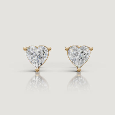 Yellow gold heart diamond stud earrings video showcasing brilliant solitaire sparkle by Raul Diamonds