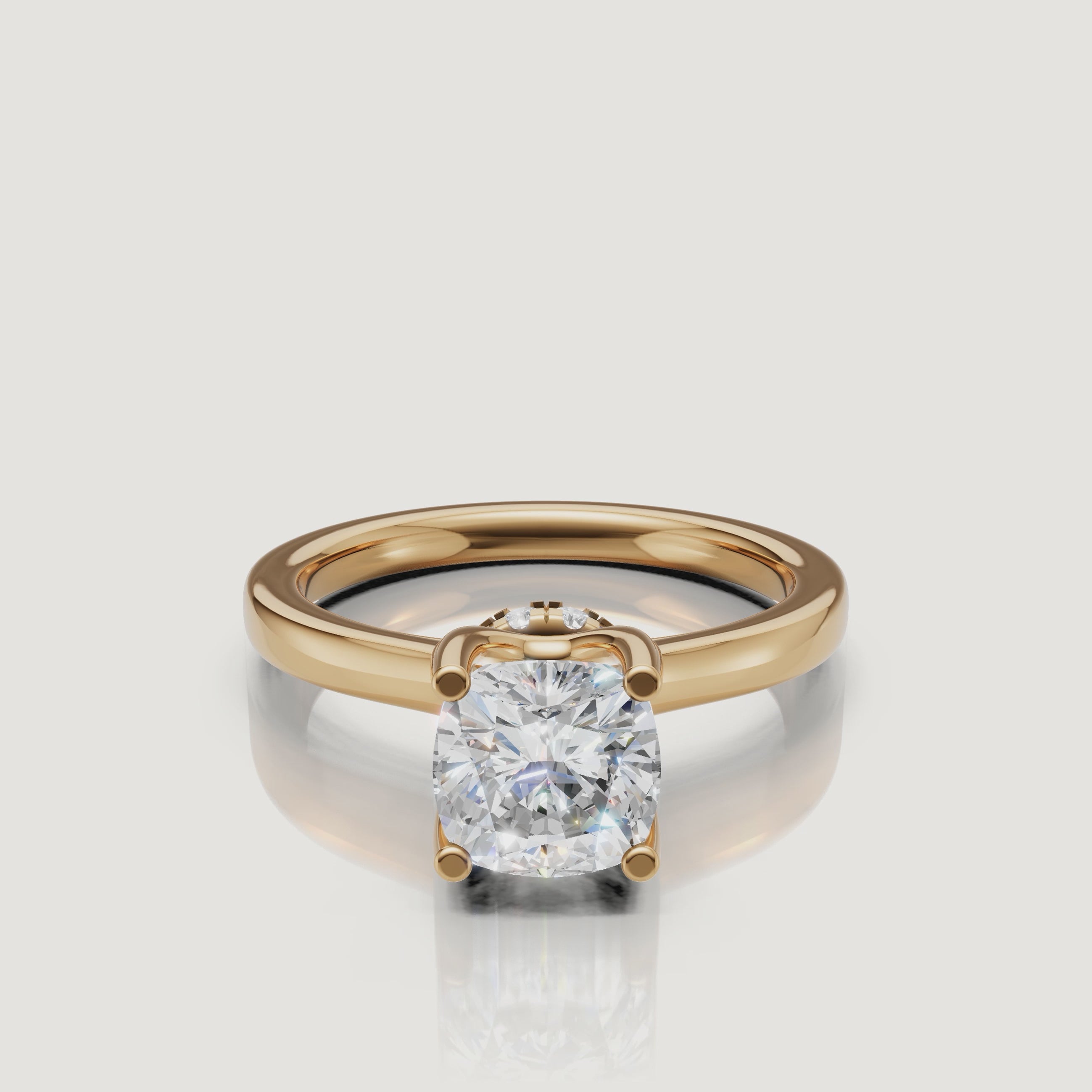 Close-up cinematic video of a Raul Diamonds cushion cut ring in yellow gold, rotating to reveal the sparkling hidden halo collar beneath the center stone