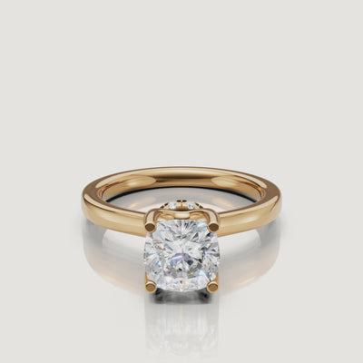 Close-up cinematic video of a Raul Diamonds cushion cut ring in yellow gold, rotating to reveal the sparkling hidden halo collar beneath the center stone