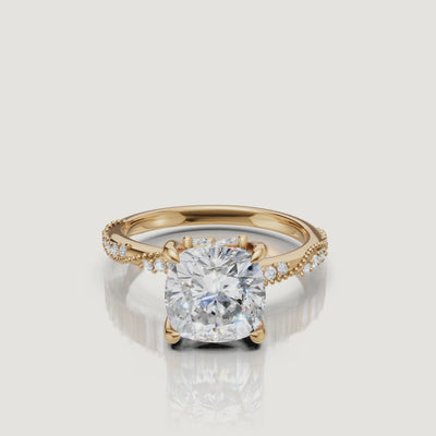14K yellow gold cushion cut lab grown diamond engagement ring with twisted pavé band sparkling beautifully in motion by Raul Diamonds
