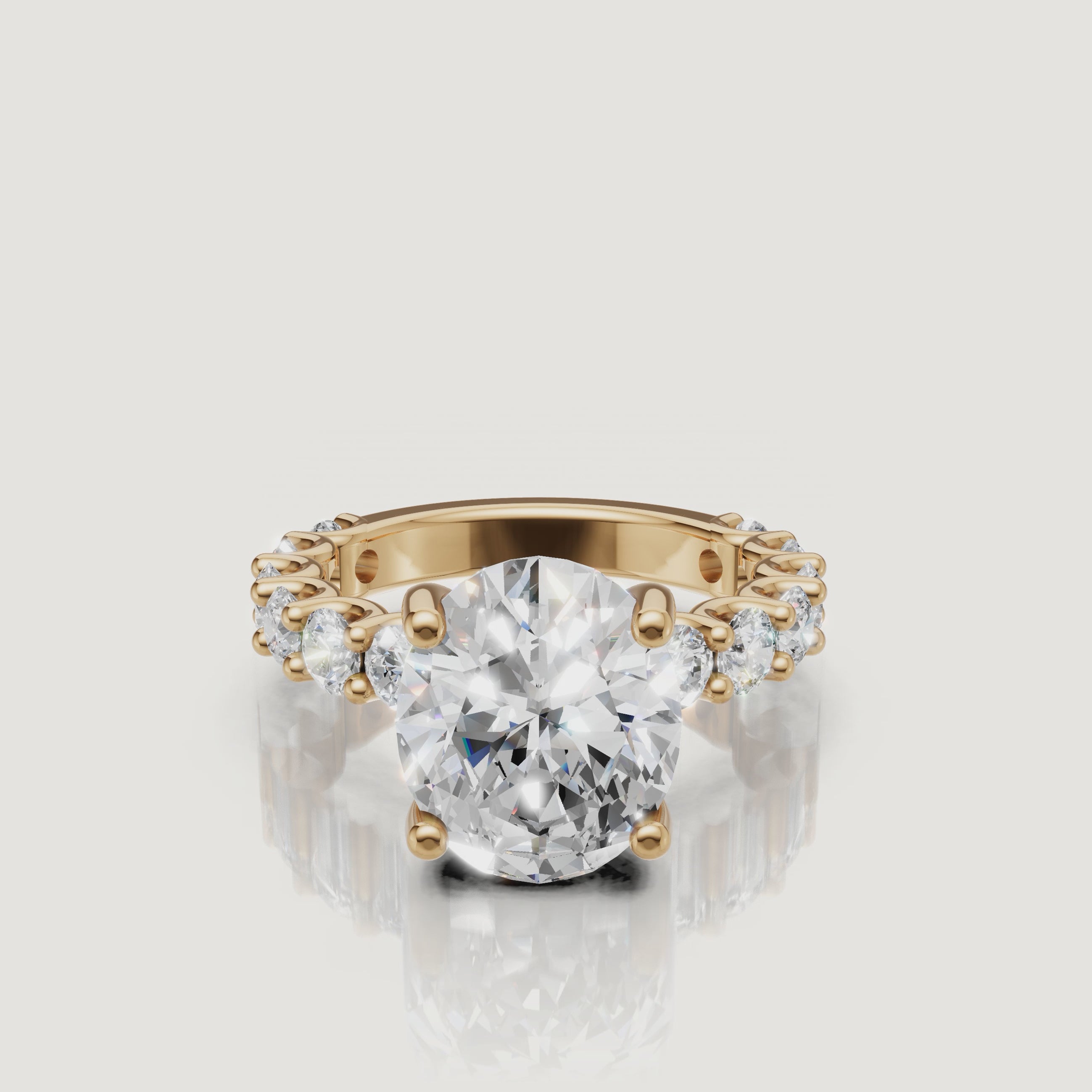 Video showcase of a Raul Diamonds oval-cut diamond engagement ring in 18k yellow gold, featuring a brilliant hidden halo and eternity band setting