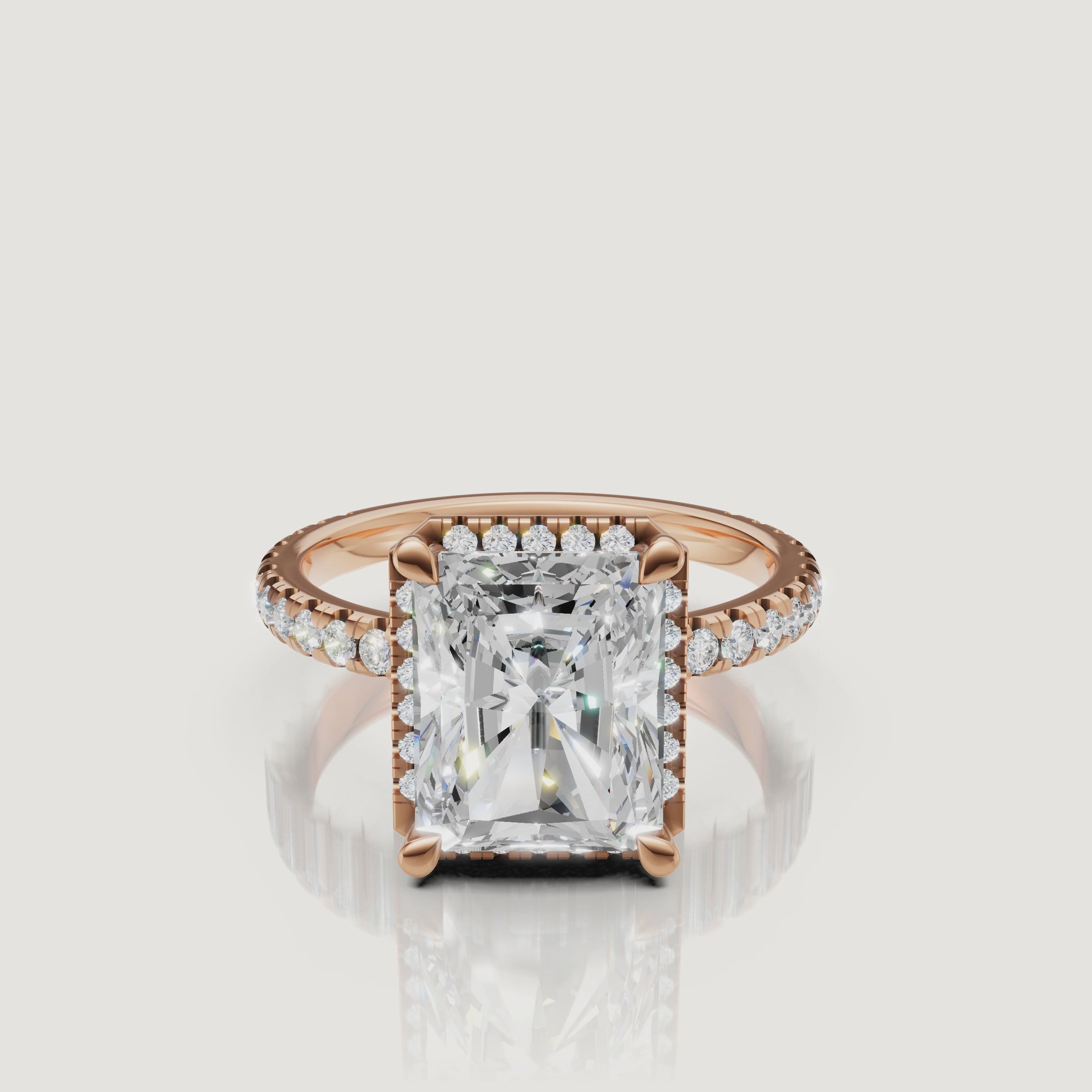Macro video showing the intense sparkle and light performance of a rose gold Radiant diamond ring featuring a hidden halo by Raul Diamonds