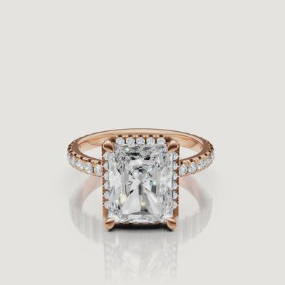 Macro video showing the intense sparkle and light performance of a rose gold Radiant diamond ring featuring a hidden halo by Raul Diamonds
