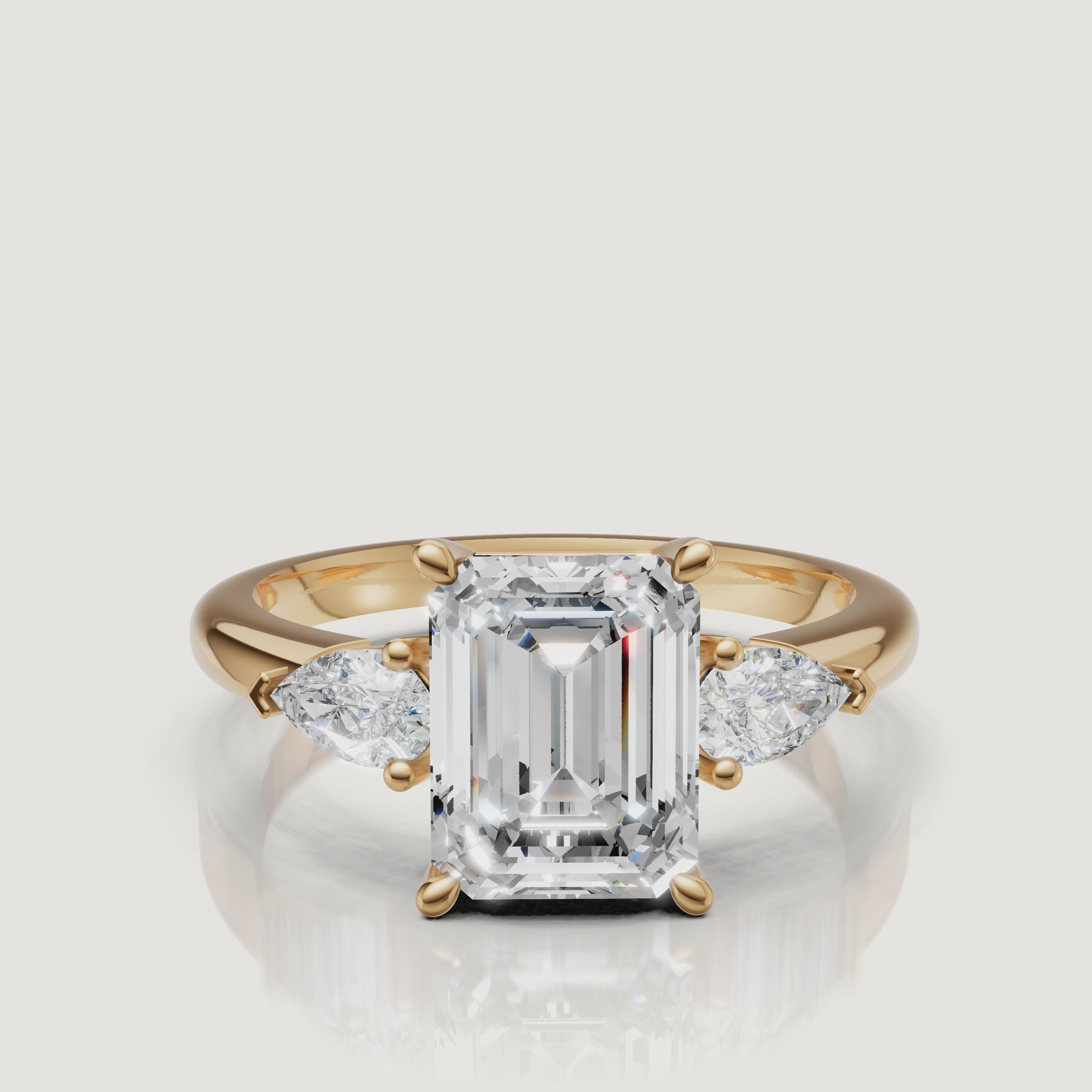 High-definition video of a Raul Diamonds emerald cut engagement ring in shimmering 18k yellow gold.