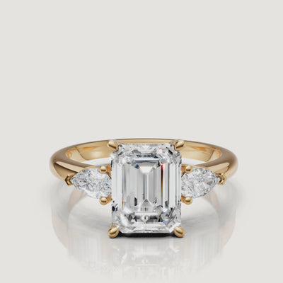 High-definition video of a Raul Diamonds emerald cut engagement ring in shimmering 18k yellow gold.