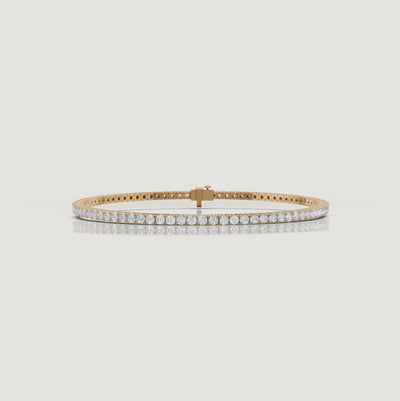 Cinematic video of a 3 carat lab grown diamond tennis bracelet in yellow gold by Raul Diamonds featuring macro diamond sparkle, graceful wrist movement, warm luxury lighting, and elegant bridal-inspired jewelry styling.