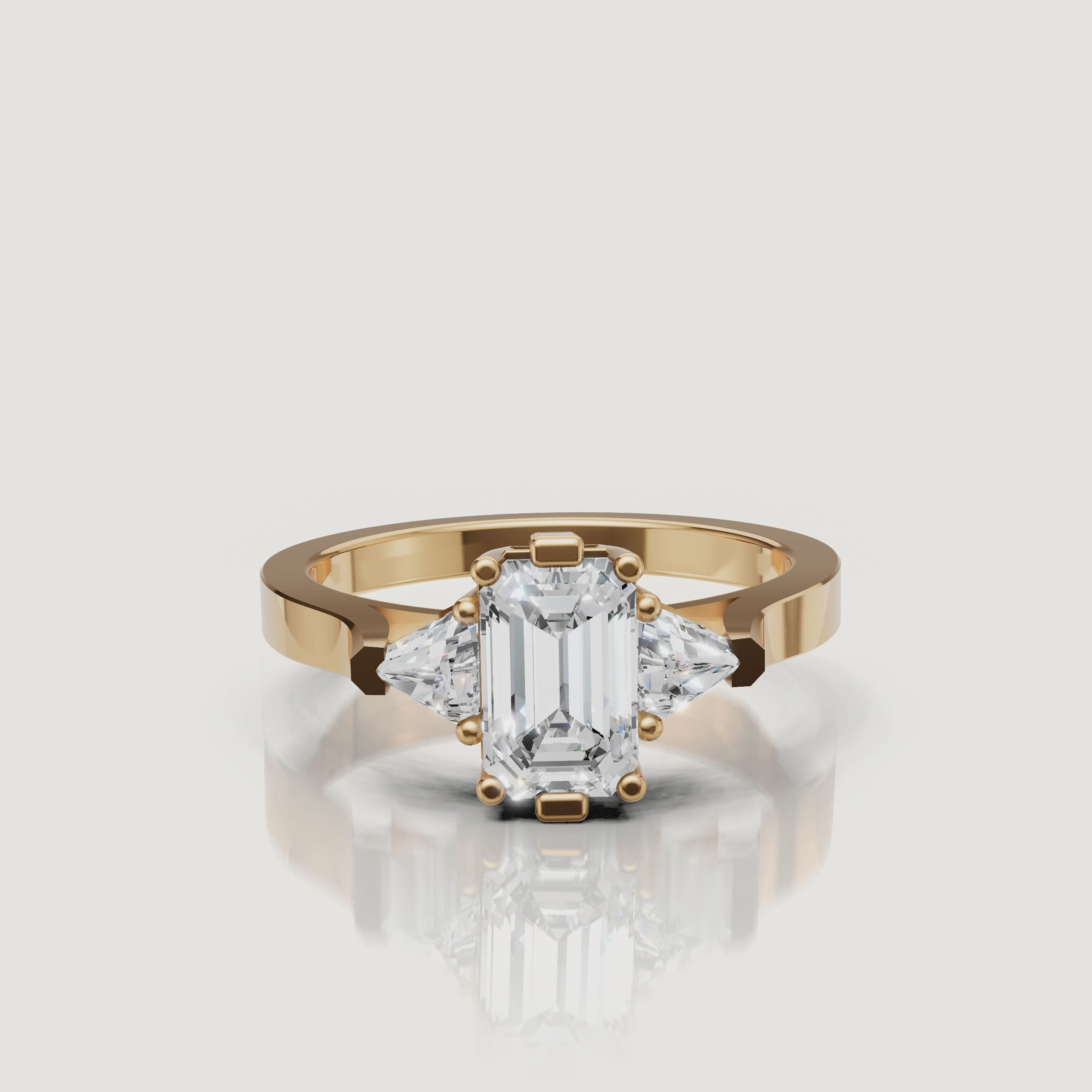 360 video of Raul Diamonds emerald cut engagement ring in yellow gold with trapezoid side diamonds.