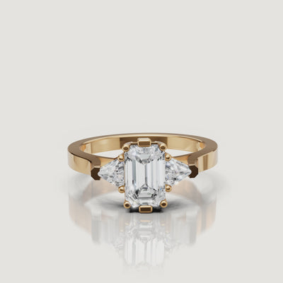 360 video of Raul Diamonds emerald cut engagement ring in yellow gold with trapezoid side diamonds.
