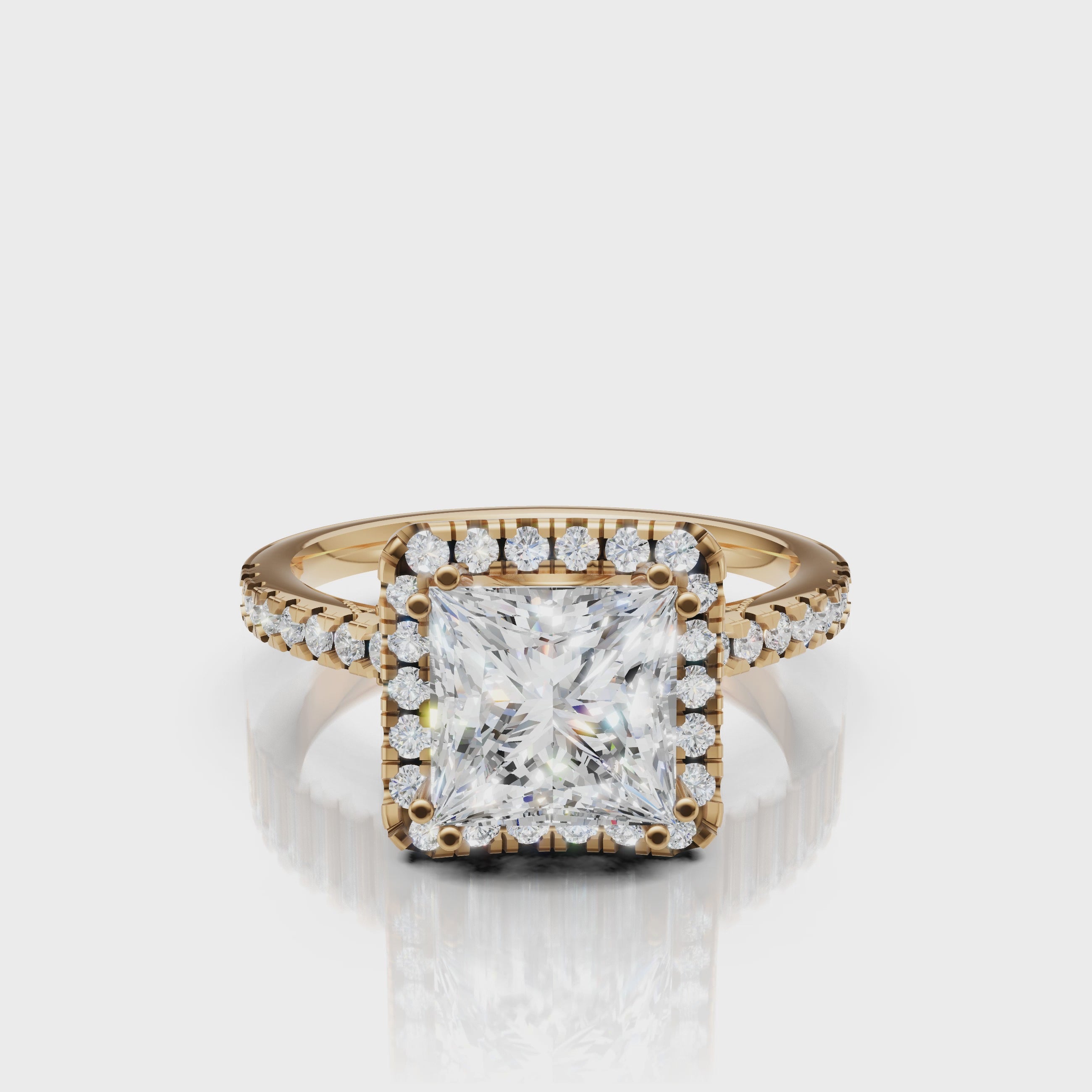 Video of princess cut lab grown diamond halo engagement ring in 14K yellow gold with pavé band by Raul Diamonds