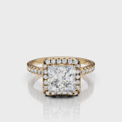 Video of princess cut lab grown diamond halo engagement ring in 14K yellow gold with pavé band by Raul Diamonds
