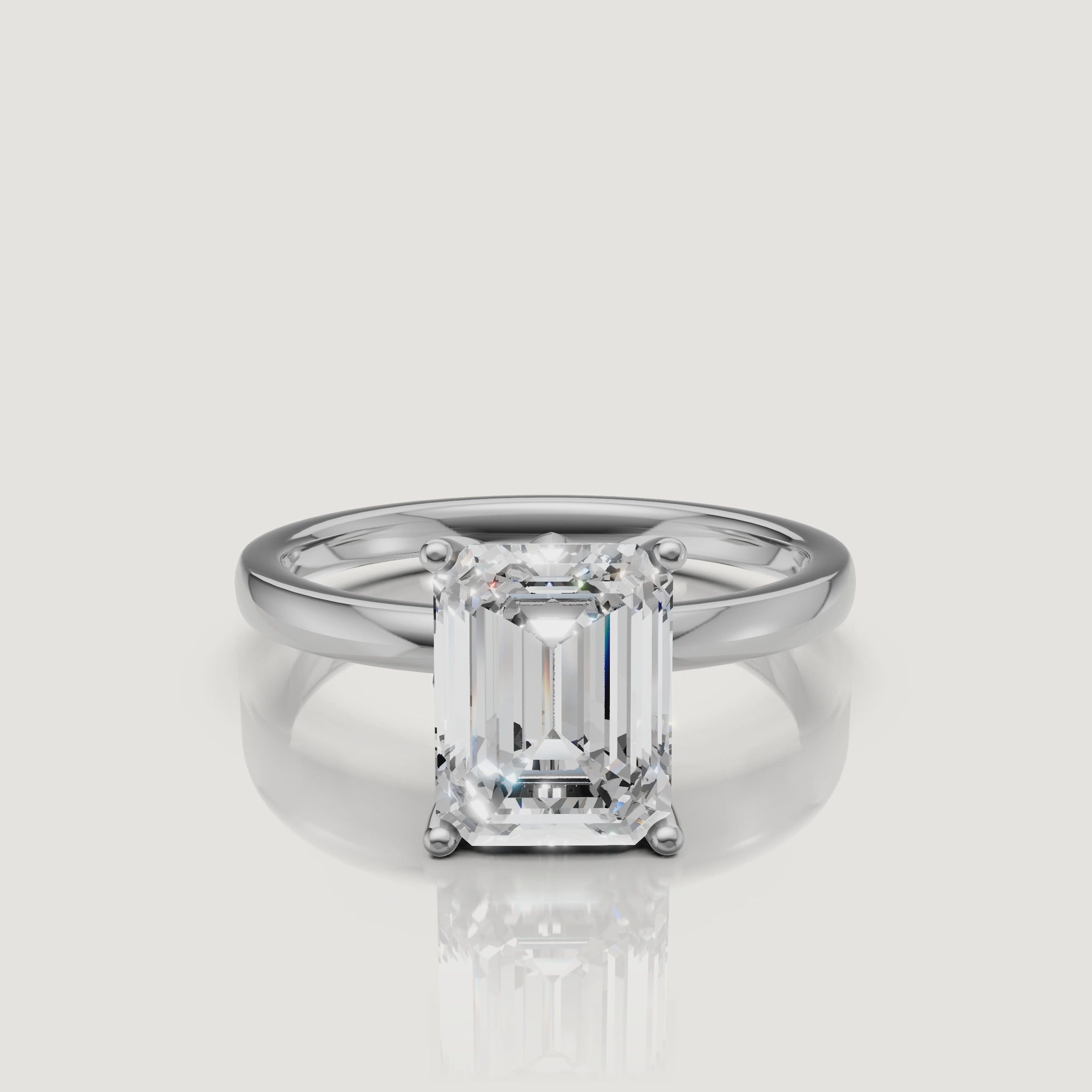 HD video showcase of a white gold emerald cut solitaire engagement ring from Raul Diamonds, demonstrating the stunning clarity and classic four-prong design