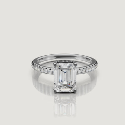 Professional video showcase of a white gold emerald cut engagement ring, emphasizing the 'hall of mirrors' center stone and Raul Diamonds signature craftsmanship.
