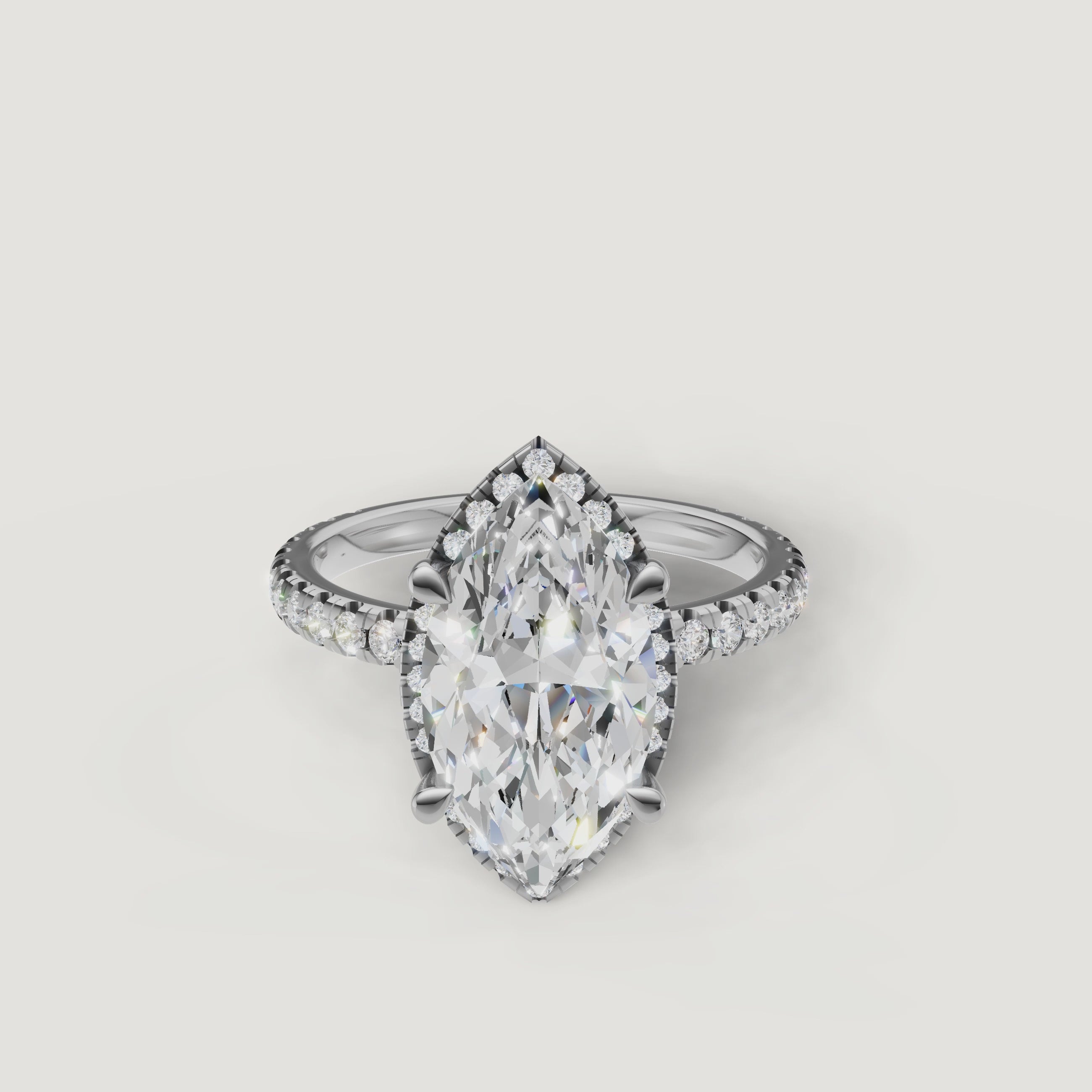 Lifestyle video of the Isabella model wearing a Raul Diamonds white gold Marquise cut engagement ring with a hidden halo setting