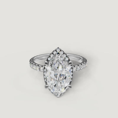 Lifestyle video of the Isabella model wearing a Raul Diamonds white gold Marquise cut engagement ring with a hidden halo setting