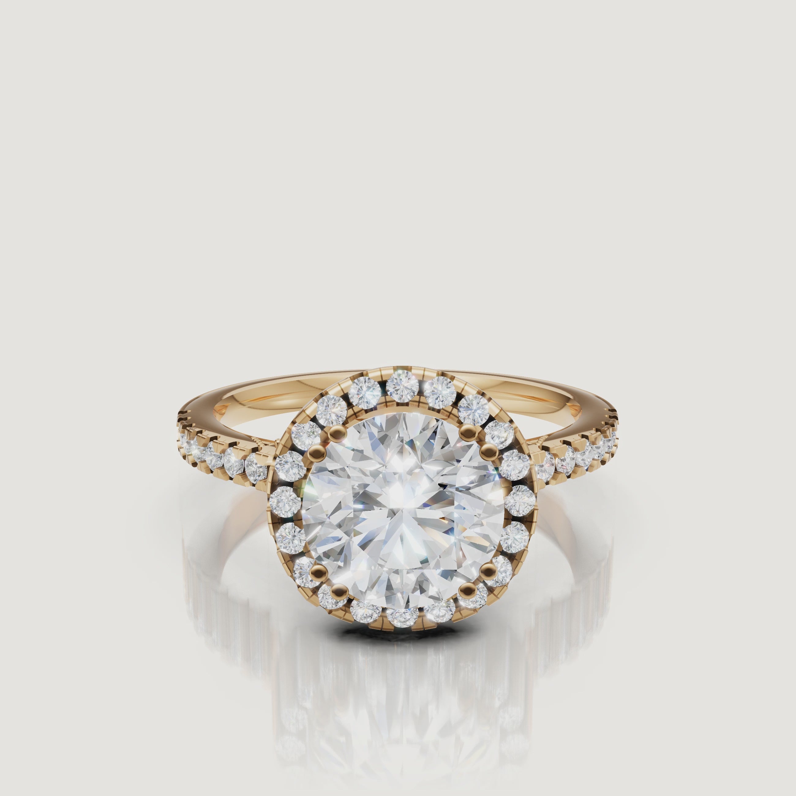 Video of round cut lab grown diamond halo engagement ring in 14K yellow gold with pavé band by Raul Diamonds