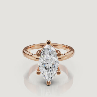 Close-up 4K video of a rose gold marquise diamond ring by Raul Diamonds, capturing the romantic pink metal and the crushed-ice effect of the facets.