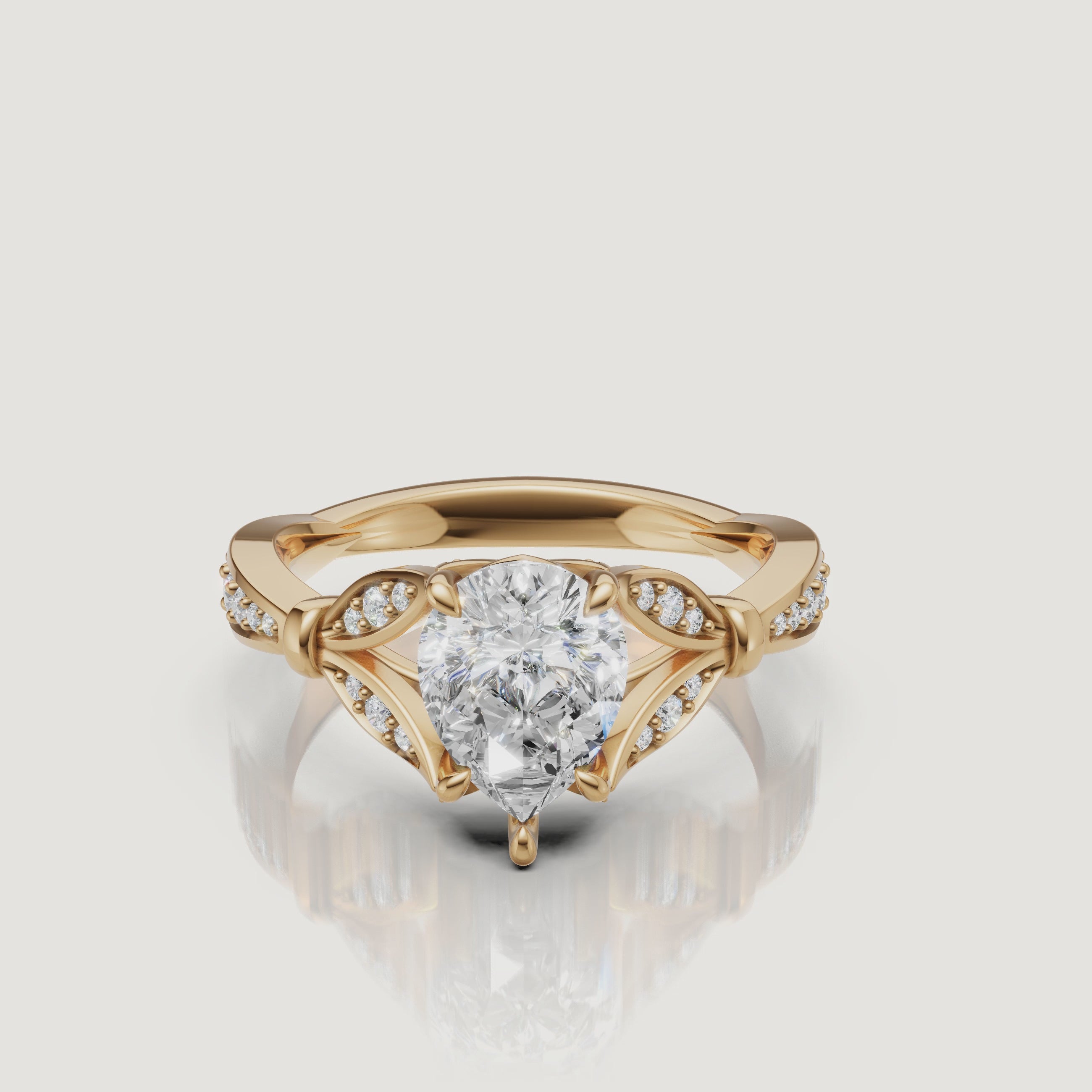 Rotating video of Raul Diamonds pear cut lab grown diamond engagement ring in 14K yellow gold with pavé accents