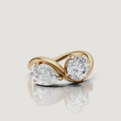 Yellow gold toi et moi diamond ring video featuring pear and round brilliant diamonds by Raul Diamonds