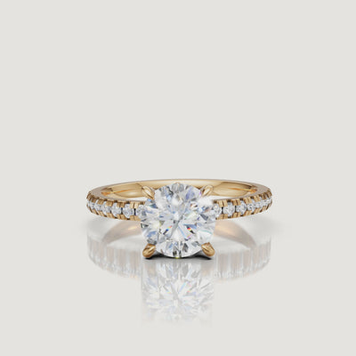 High-definition 360-degree video of a Raul Diamonds yellow gold round cut ring, highlighting the contrast between the warm gold band and the sparkling diamond facets.
