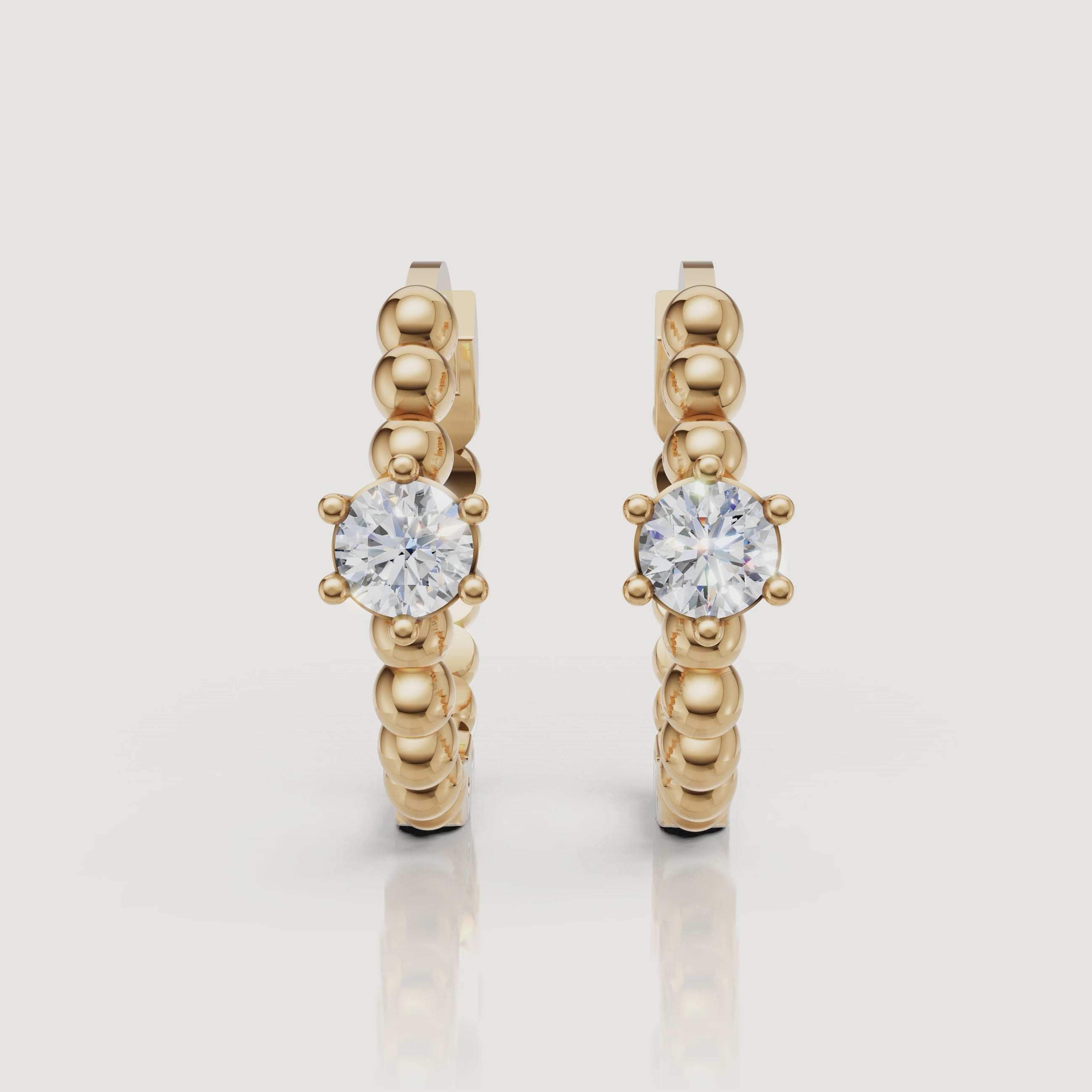 Yellow gold beaded diamond hoop earrings video by Raul Diamonds