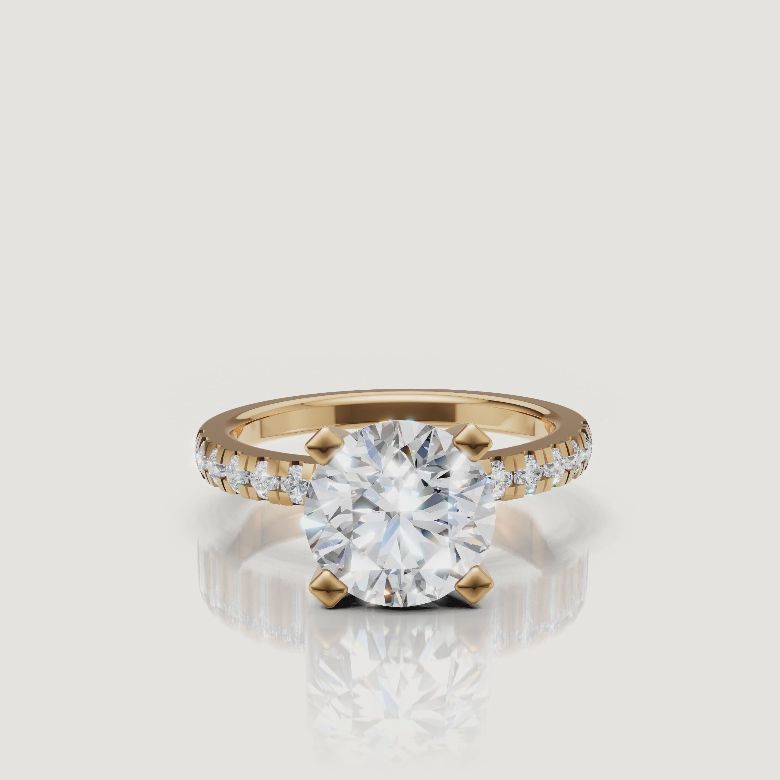 360 video of Raul Diamonds round solitaire engagement ring in yellow gold with pavé diamonds.