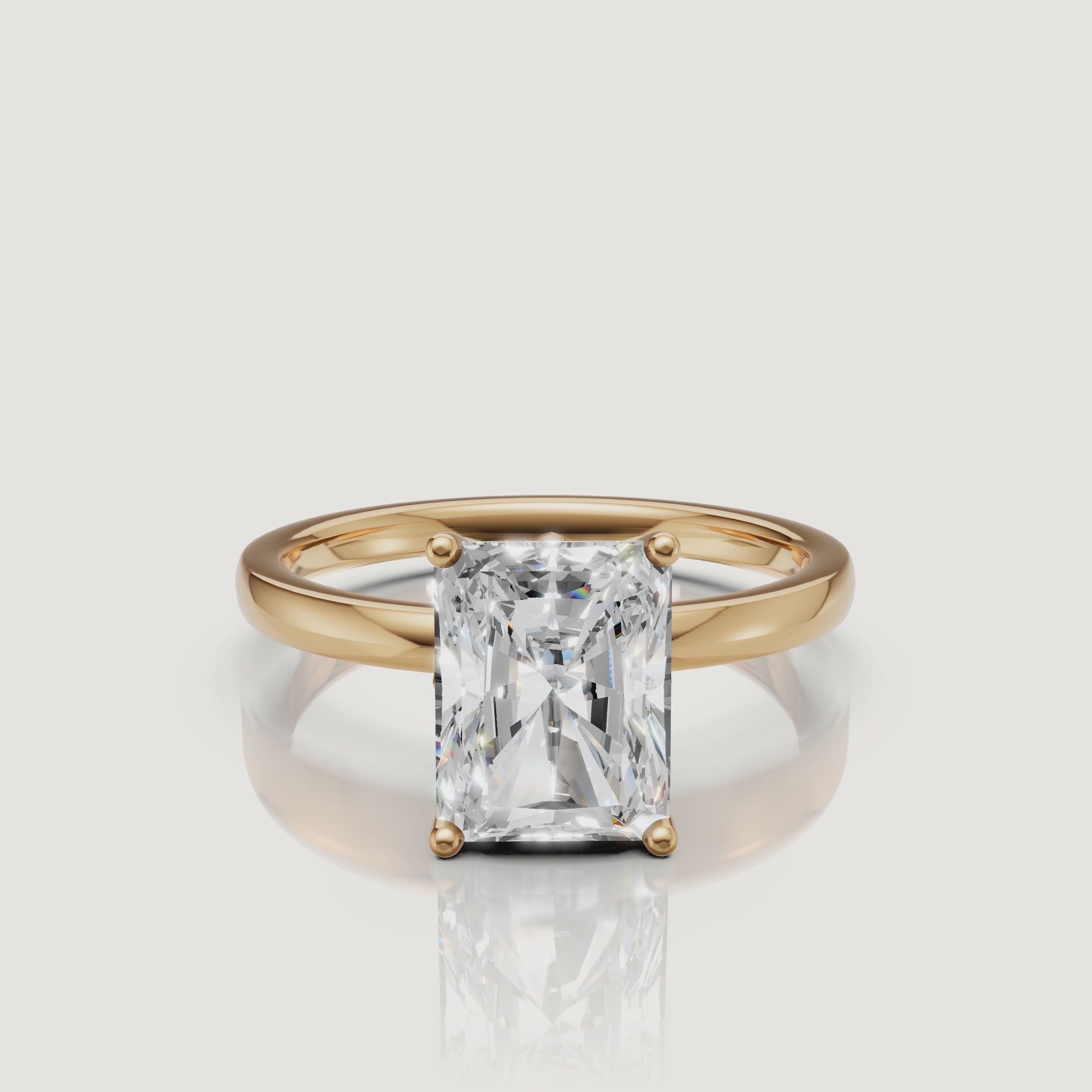 High-definition product video of a Raul Diamonds radiant cut solitaire ring in yellow gold, highlighting the crushed-ice sparkle and classic gold band.