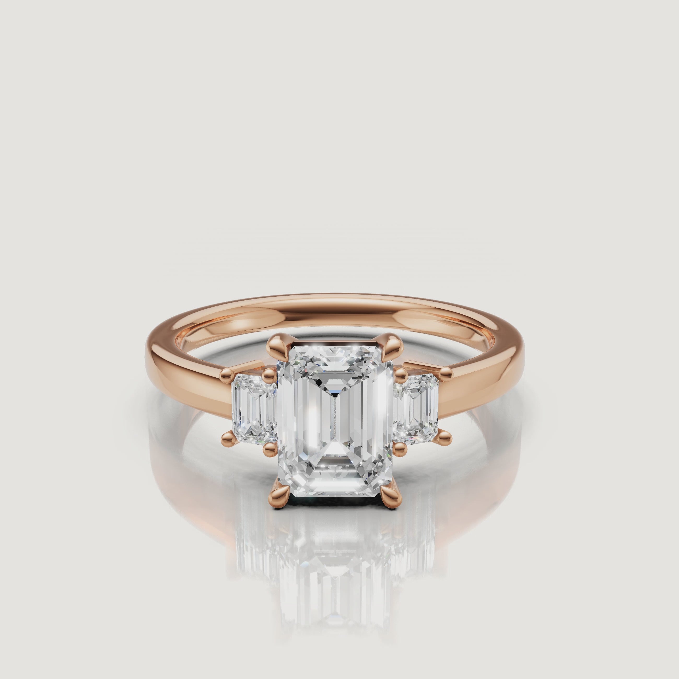 Cinematic close-up of a Rual Diamonds two-stone emerald cut diamond ring in rose gold, capturing the romantic warmth and exceptional fire of the modern Toi et Moi design in motion