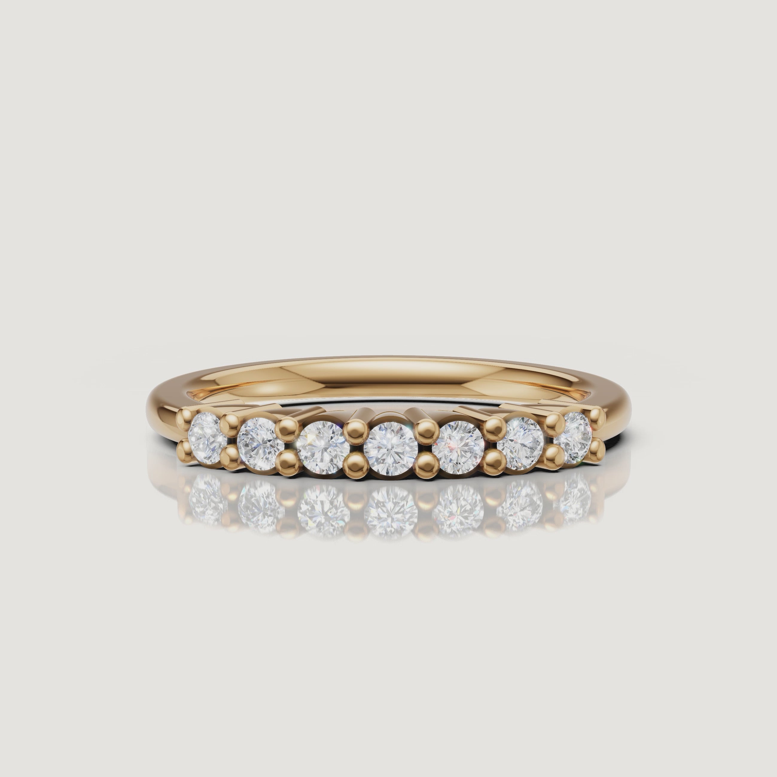 Yellow gold round diamond shared prong wedding band video by Raul Diamonds