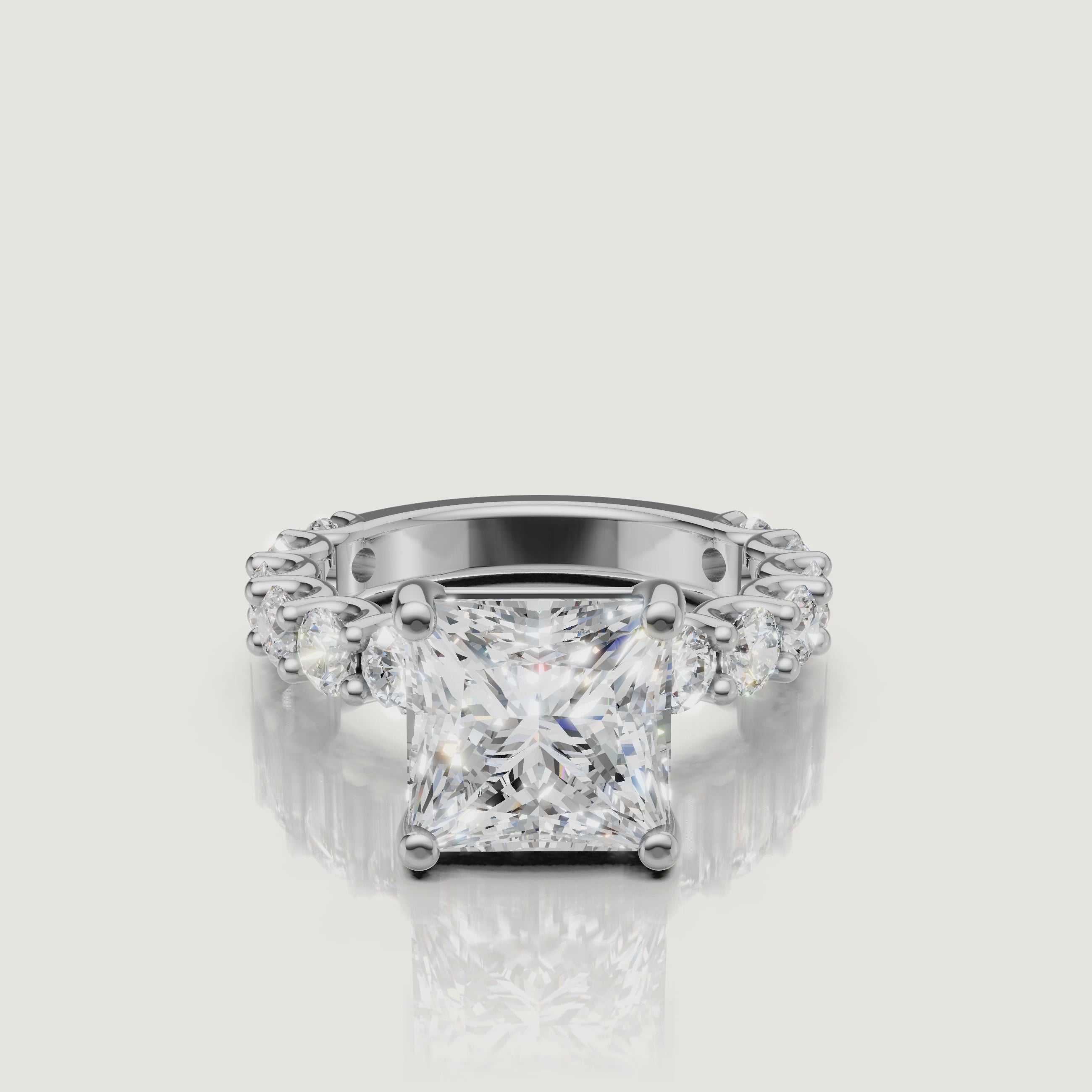 360-degree view of a white gold princess-cut diamond ring from Raul Diamonds, emphasizing the modern square silhouette and high-clarity eternity shank