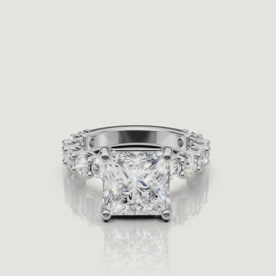 360-degree view of a white gold princess-cut diamond ring from Raul Diamonds, emphasizing the modern square silhouette and high-clarity eternity shank