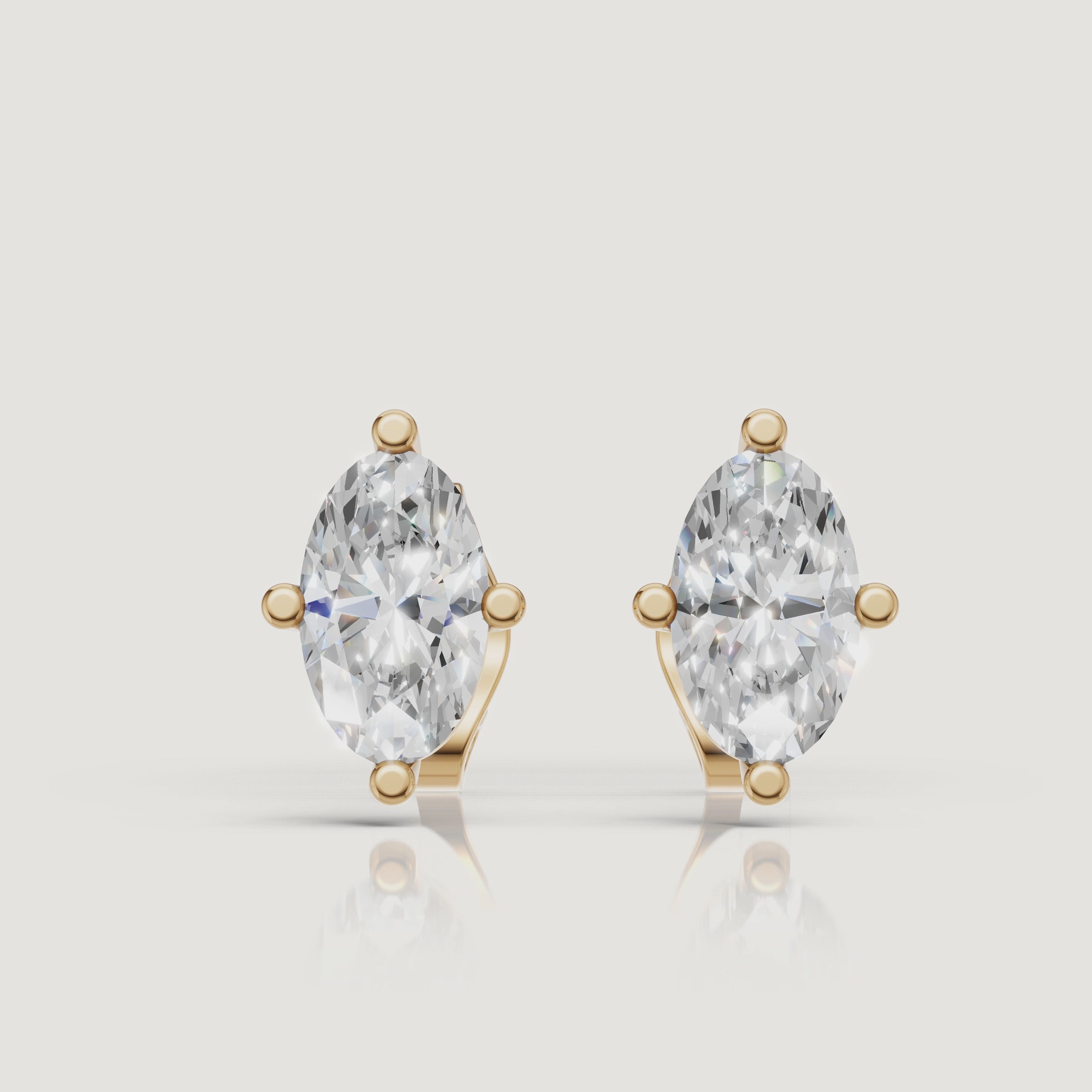 Yellow gold marquise diamond stud earrings video showcasing solitaire brilliance by Raul Diamonds