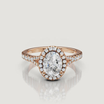 Cinematic close-up of a rose gold oval diamond halo ring, showcasing the elegant split shank and the warm pink glow of the metal.