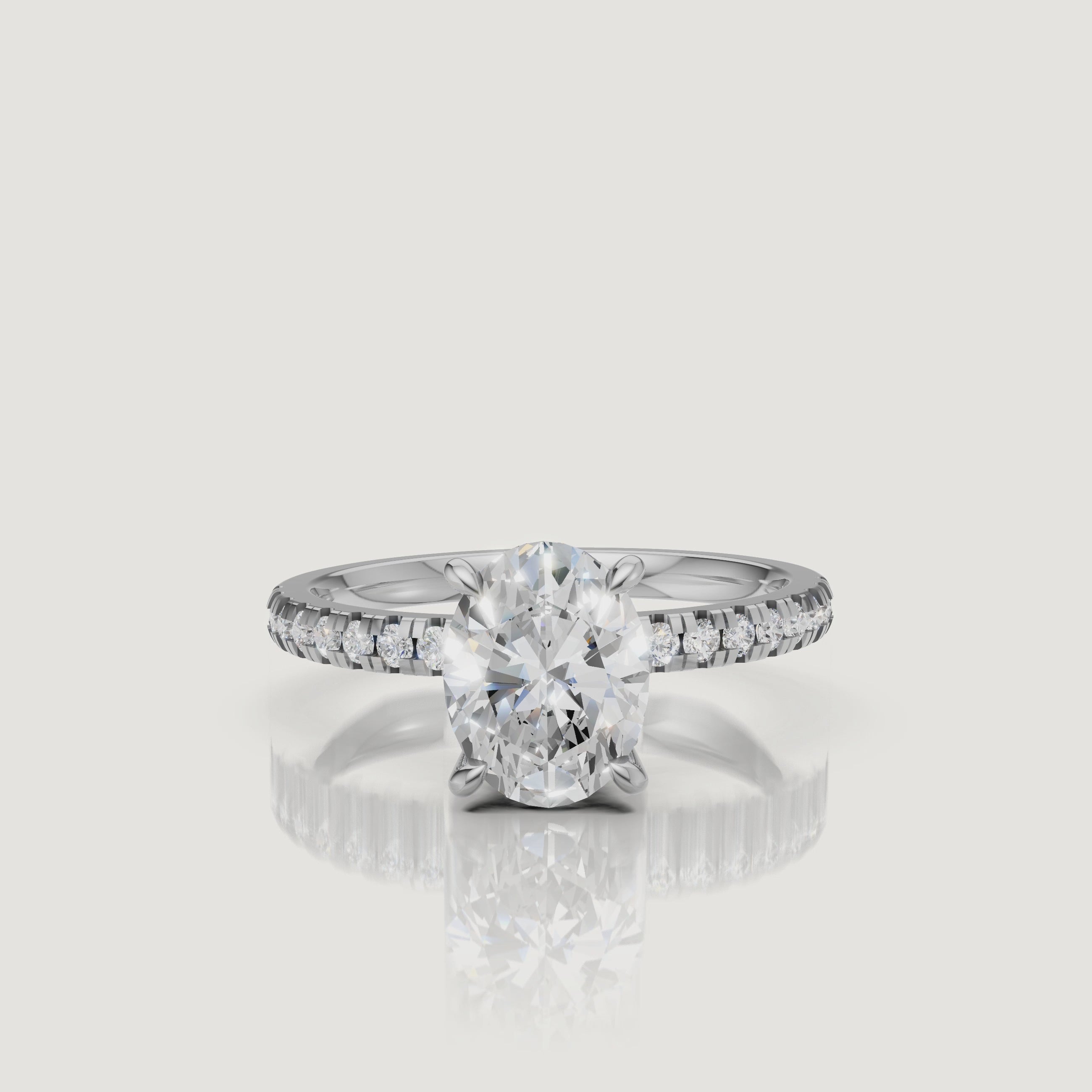 Professional 360-degree video of a white gold oval diamond ring, emphasizing the icy brilliance of the center stone and the seamless pavé setting.