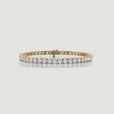 Cinematic video of a 7 carat lab grown diamond tennis bracelet in 14K yellow gold by Raul Diamonds featuring round brilliant diamonds, luxury macro close-ups, natural wrist movement, warm studio lighting, and premium fine jewelry craftsmanship.