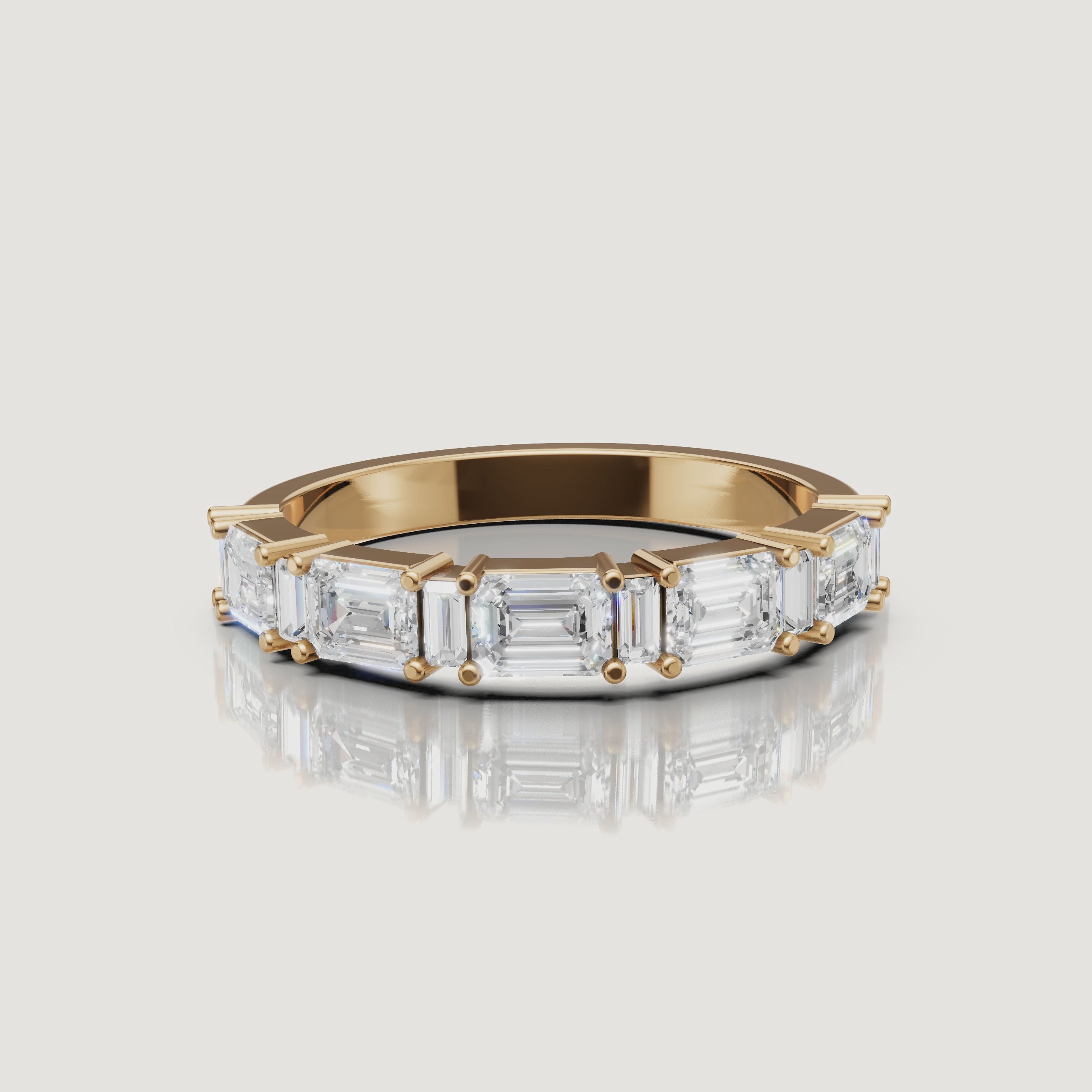 Raul Diamonds yellow gold emerald cut diamond wedding band video with sparkling eternity design