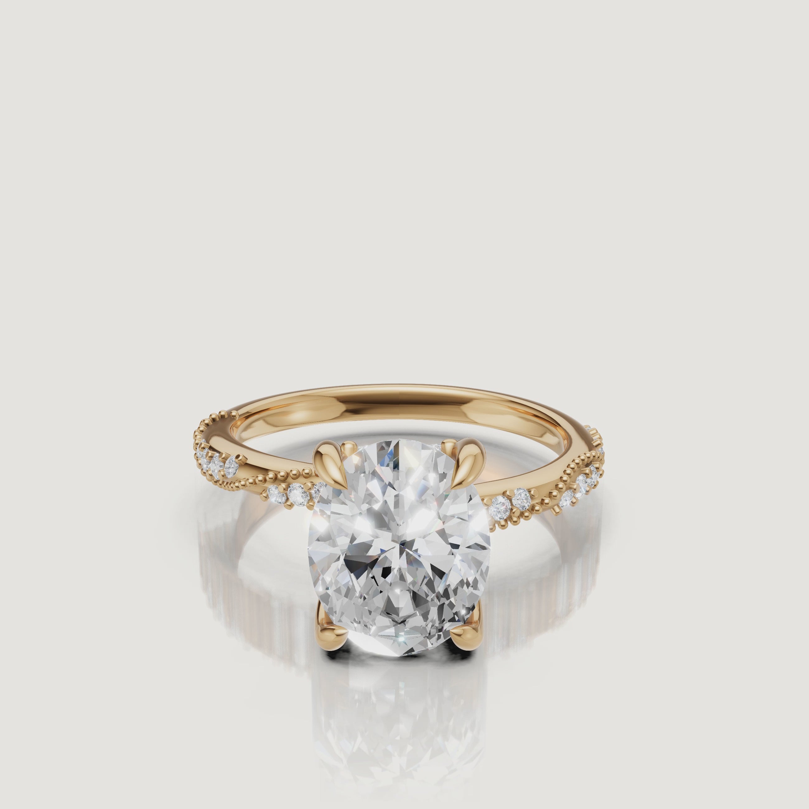 14K yellow gold oval cut lab grown diamond engagement ring with twisted pavé band and elongated sparkle by Raul Diamonds