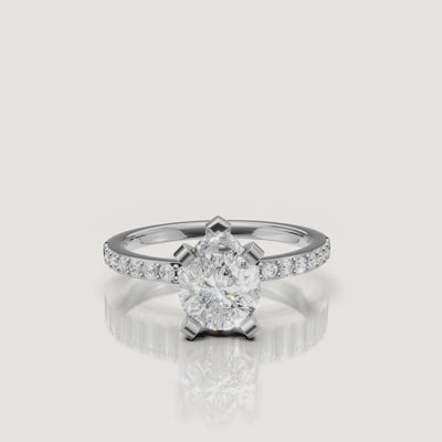 High-definition video of the Raul Diamonds white gold pear cut engagement ring, focusing on the crisp facets of the diamond and the seamless brilliance of the pavé setting.