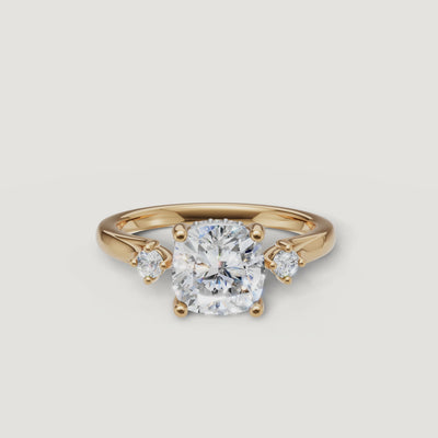 14K yellow gold cushion cut lab grown diamond engagement ring with round side diamonds by Raul Diamonds