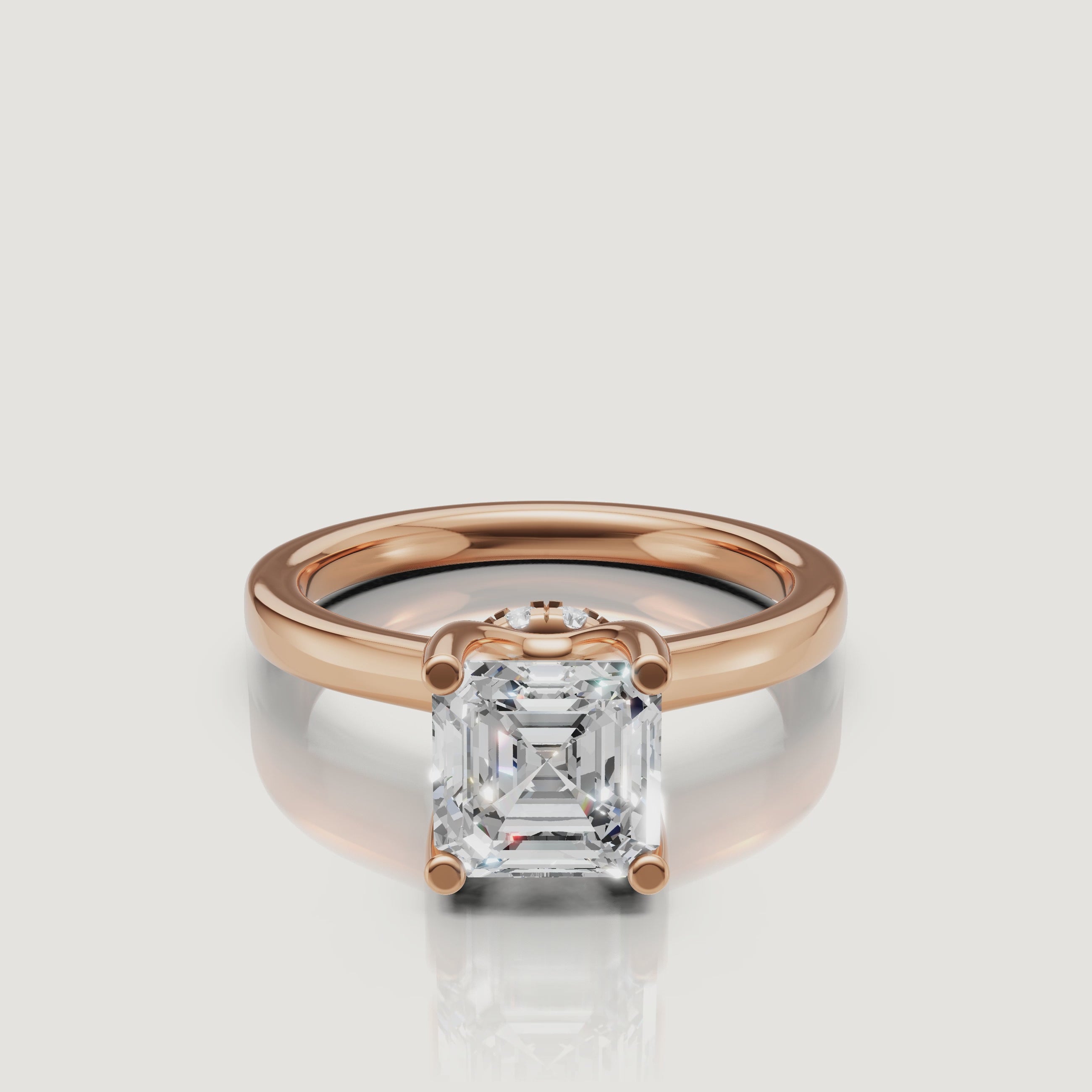 High-definition video of the Raul Diamonds rose gold Asscher ring, focusing on the unique 'X' pattern of the step-cut diamond facets