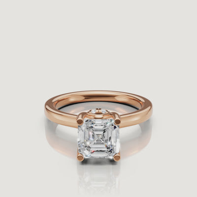 High-definition video of the Raul Diamonds rose gold Asscher ring, focusing on the unique 'X' pattern of the step-cut diamond facets
