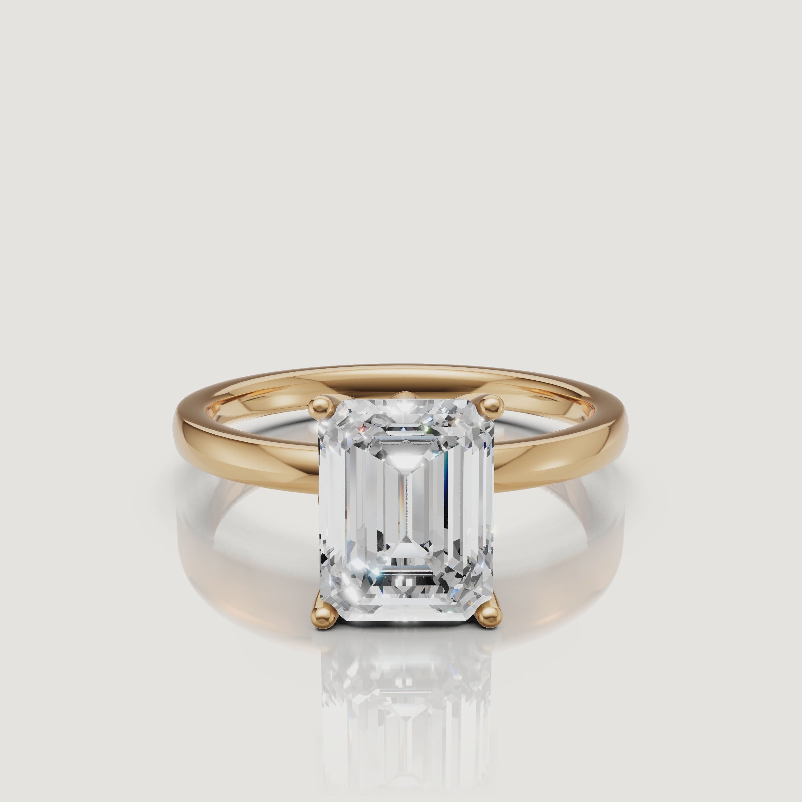 Product video of a Raul Diamonds emerald cut solitaire ring in yellow gold, rotating to show the linear facets and the high-polish 14k gold setting