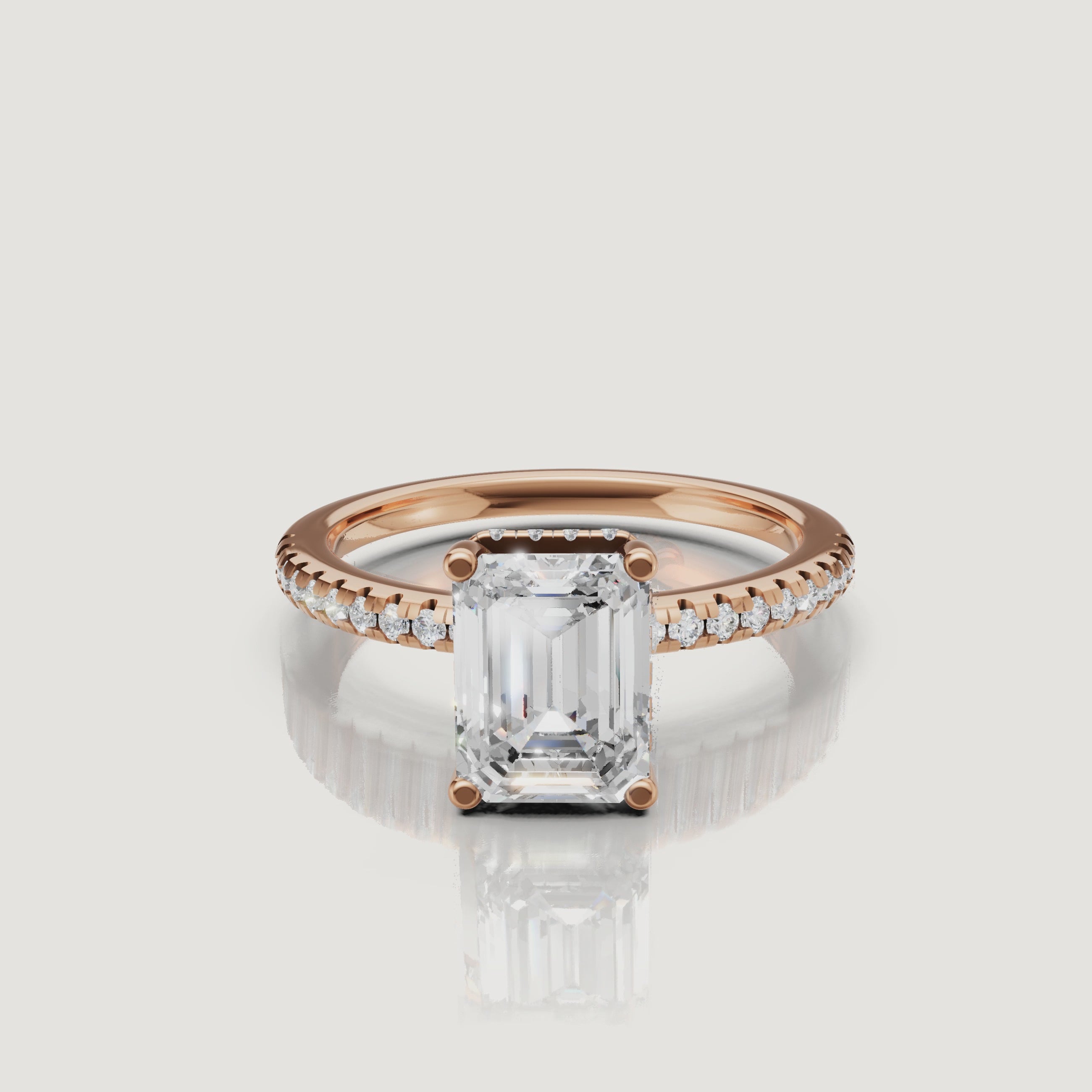 Close-up video of a Raul Diamonds rose gold emerald cut ring, highlighting the sophisticated step-cut facets and pink gold pavé band