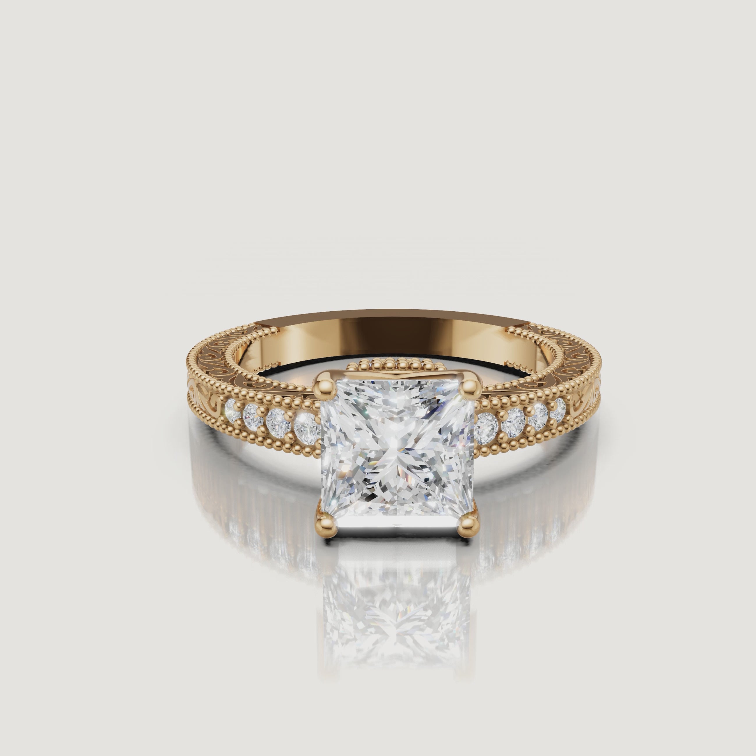 360 video of vintage princess cut lab grown diamond engagement ring in 14K yellow gold with intricate filigree detailing by Raul Diamonds.