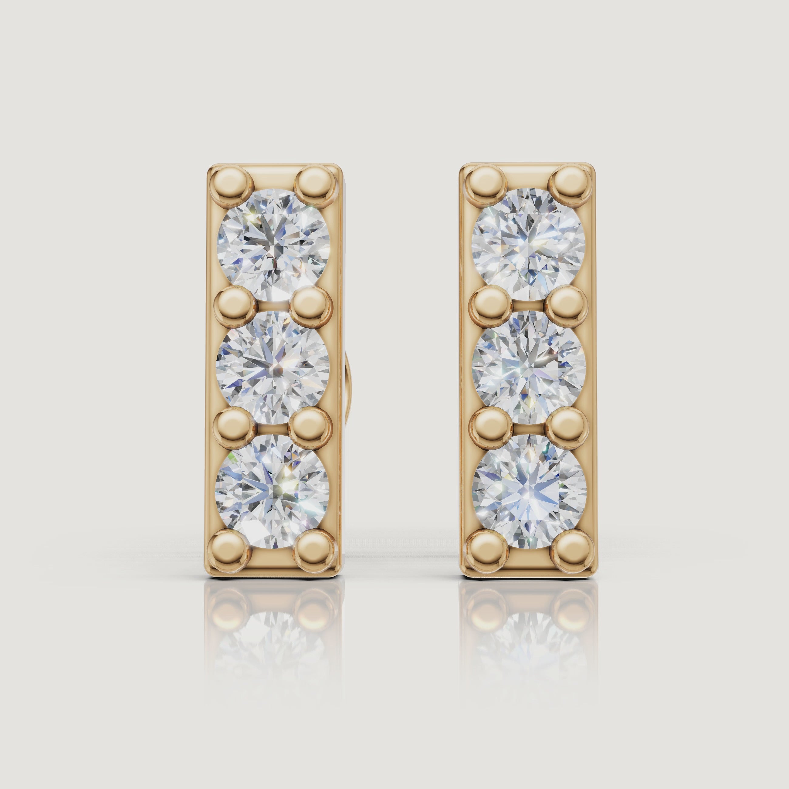 Yellow gold three stone diamond bar earrings sparkling jewelry video Raul Diamonds