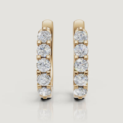 Yellow gold diamond hoop earrings video featuring sparkling round lab grown diamonds in a luxury fine jewelry style by Raul Diamonds