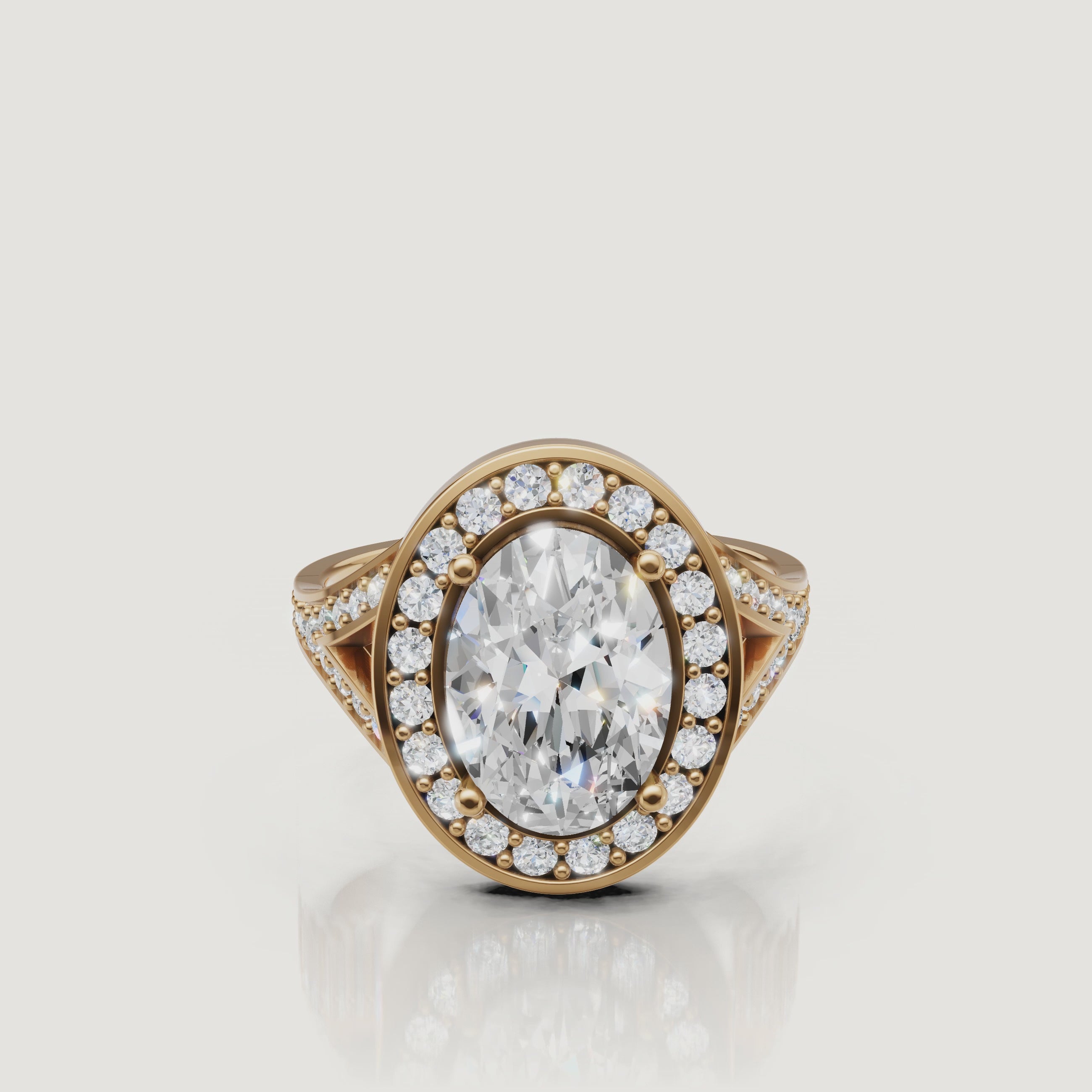 360 video of Raul Diamonds oval halo engagement ring in yellow gold with pavé diamonds.
