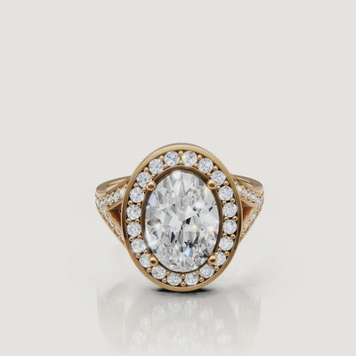 360 video of Raul Diamonds oval halo engagement ring in yellow gold with pavé diamonds.