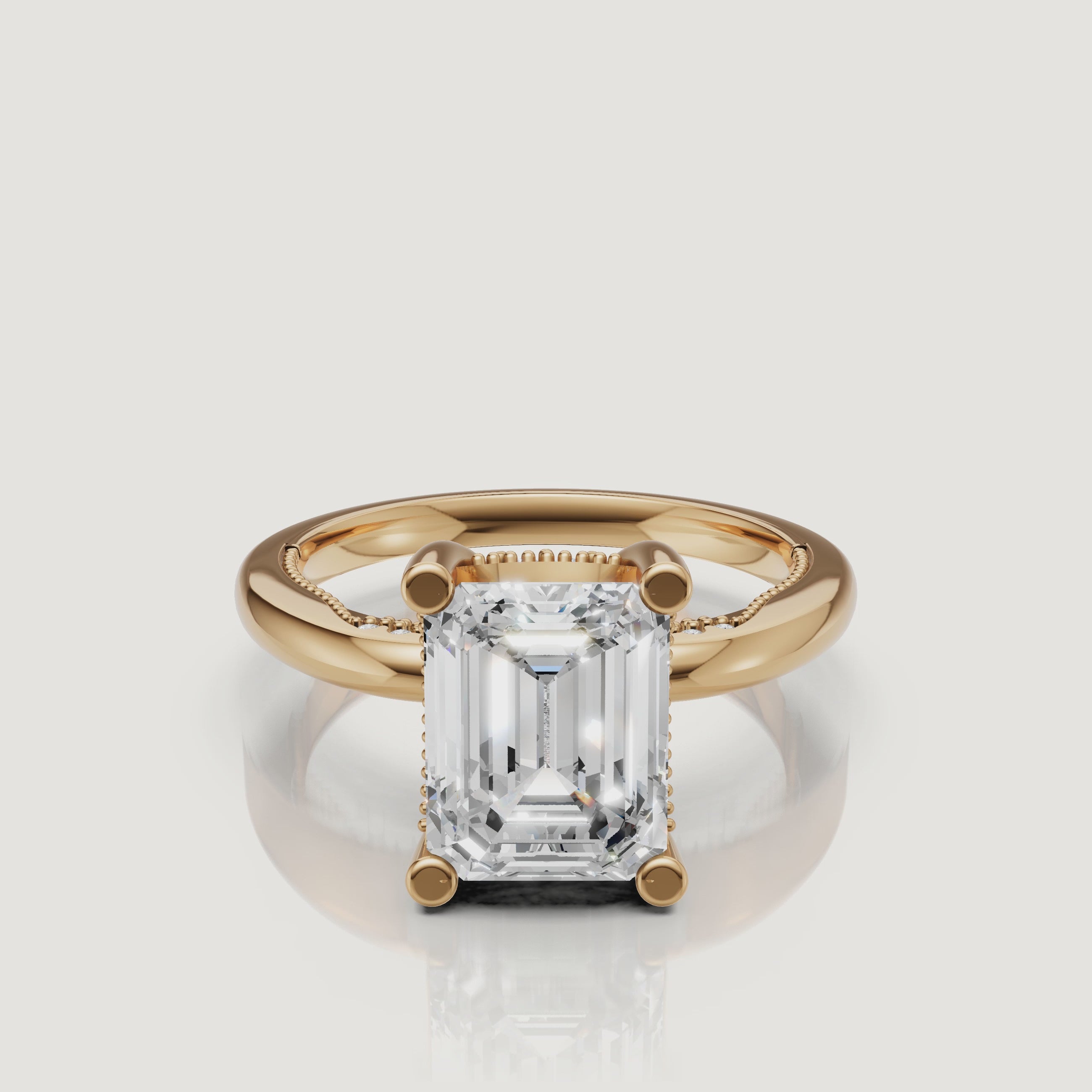 A 360-degree high-definition video of a Raul Diamonds emerald cut ring in 18k yellow gold, highlighting the hall-of-mirrors light effect
