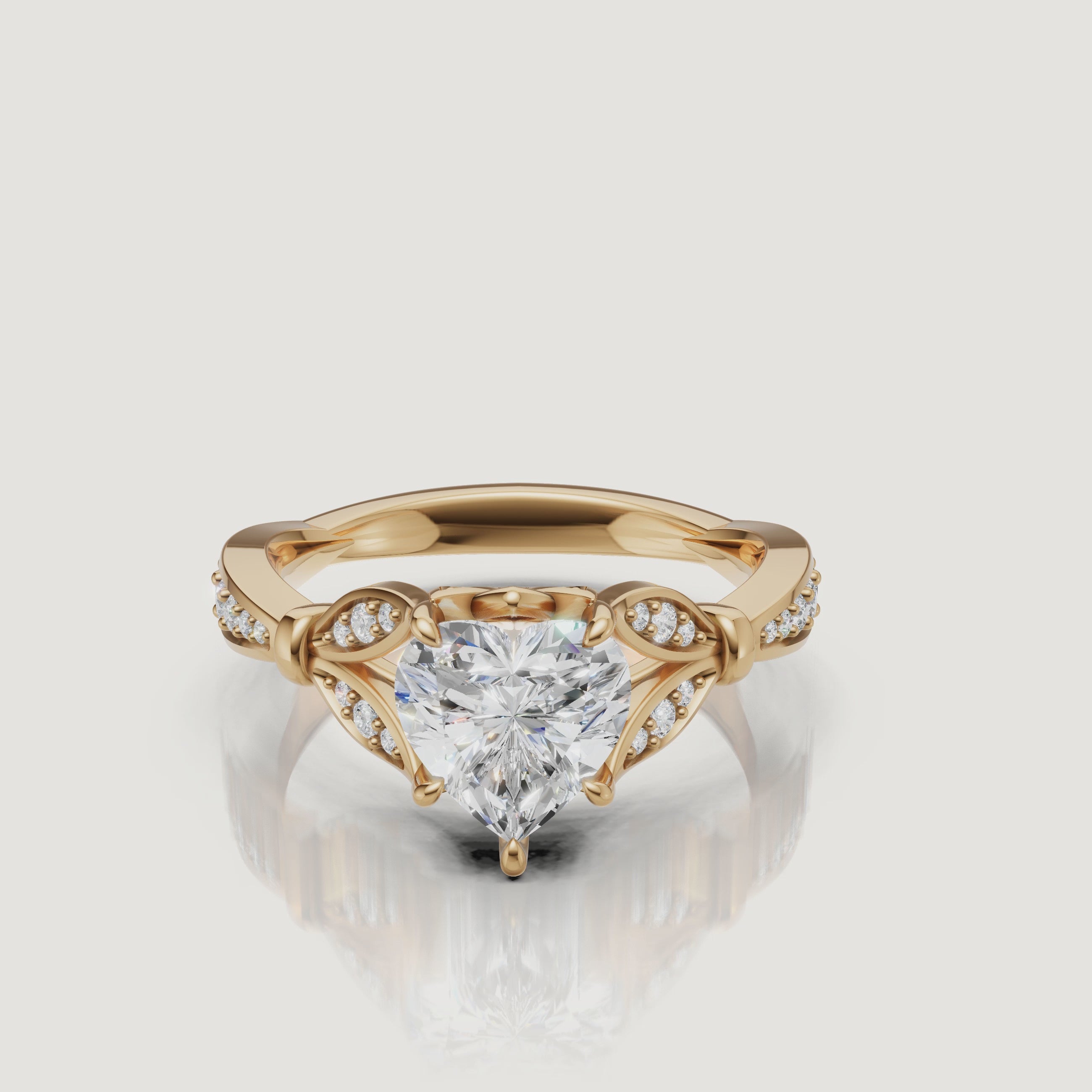 Rotating video of Raul Diamonds heart cut lab grown diamond engagement ring in 14K yellow gold with pavé accents